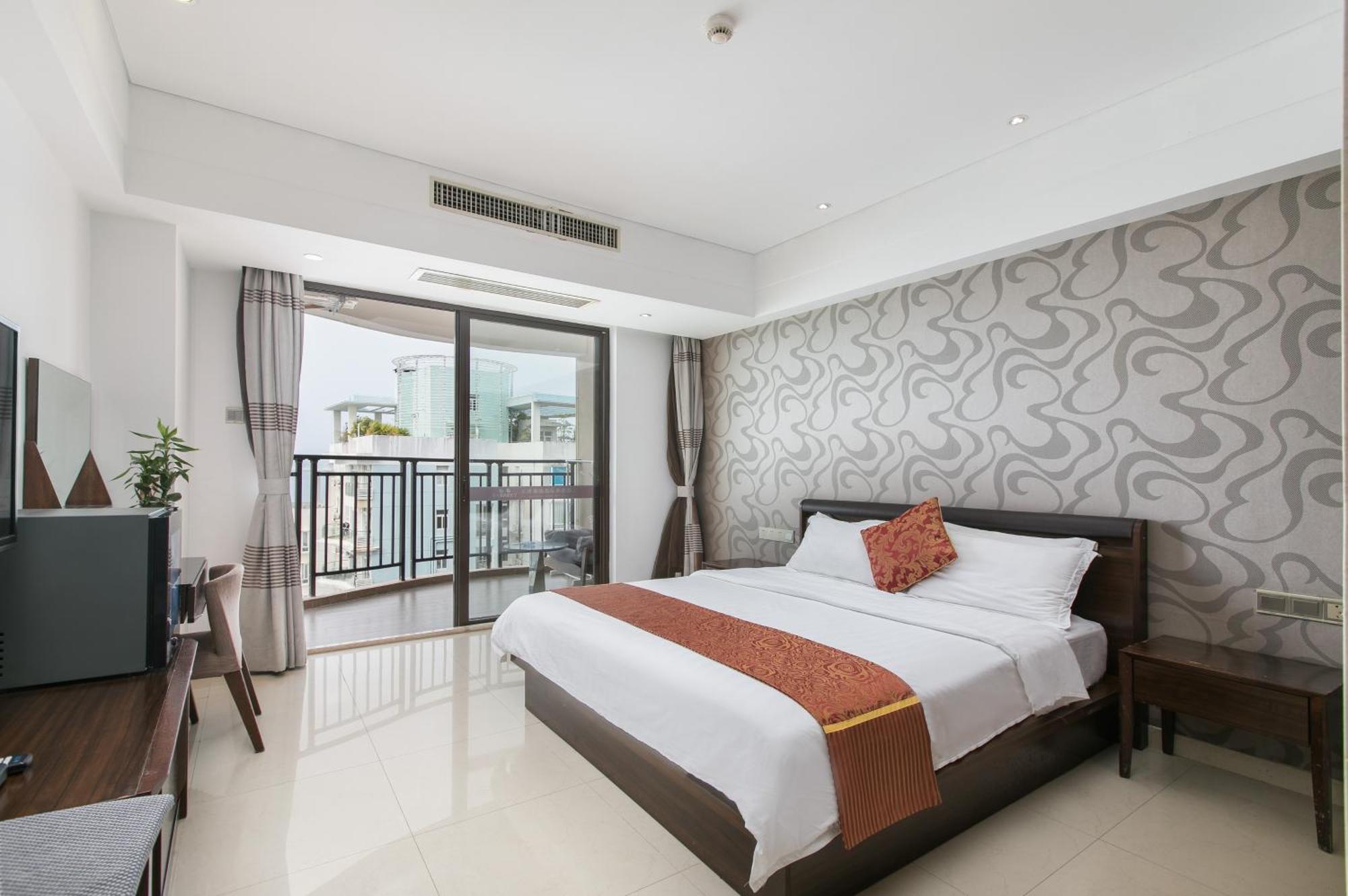 Апарт готель Sanya Sun And Sea Gueshouse Номер фото